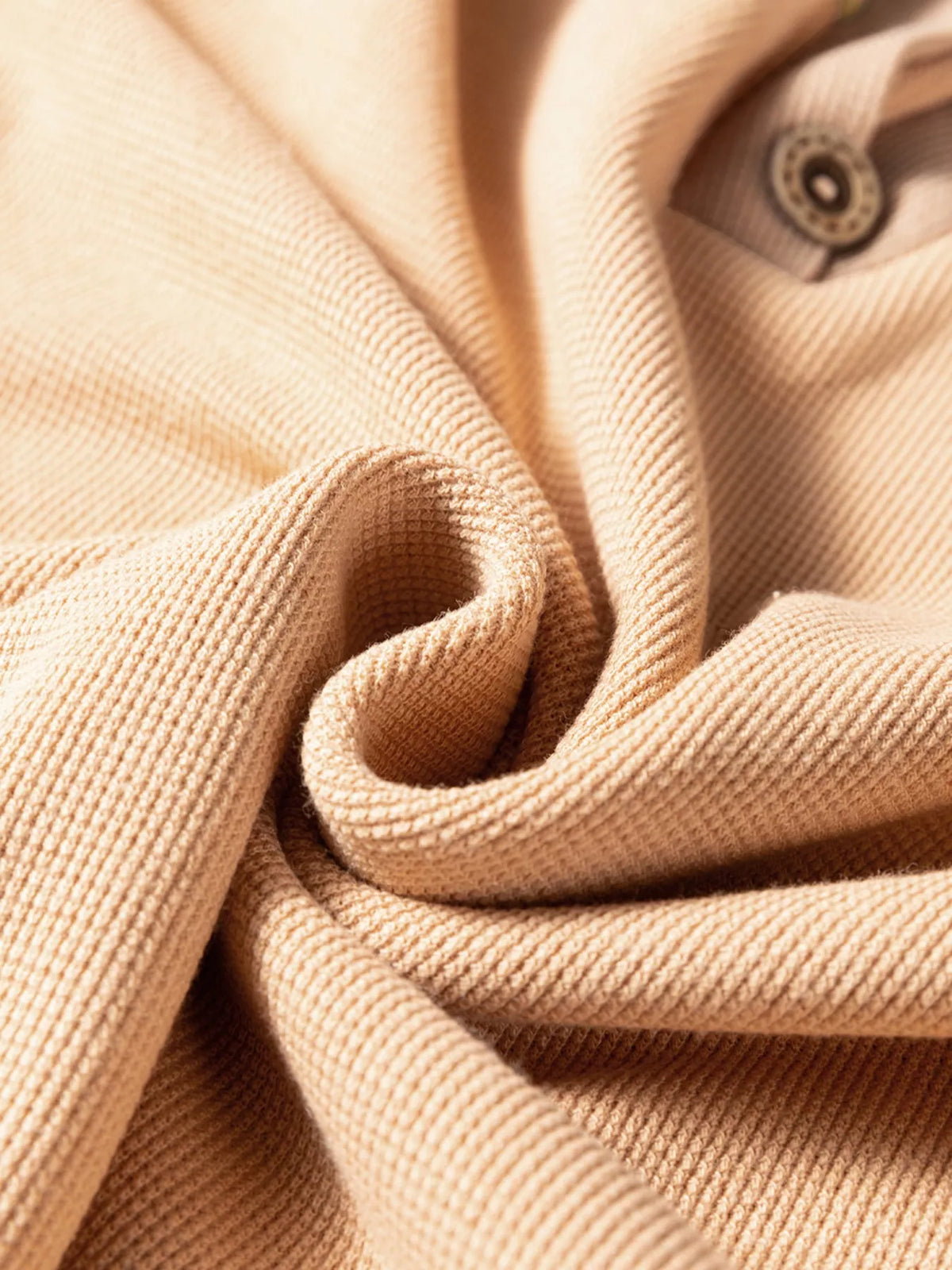 Camel thermal textured knit henley top, button placket and fabric close-up