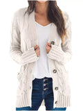 Cream chunky cable-knit button-front cardigan with long sleeves and ribbed cuffs