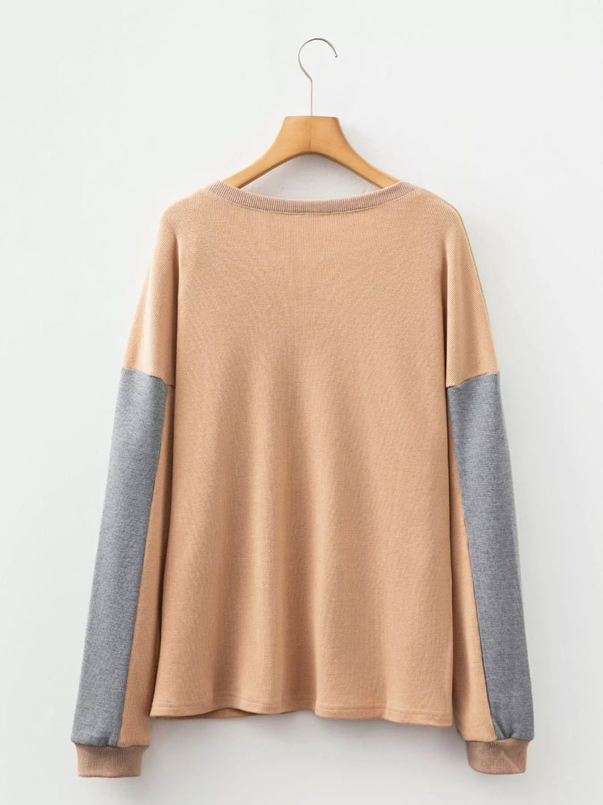 Back view on hanger of camel color block thermal henley with green and gray sleeves