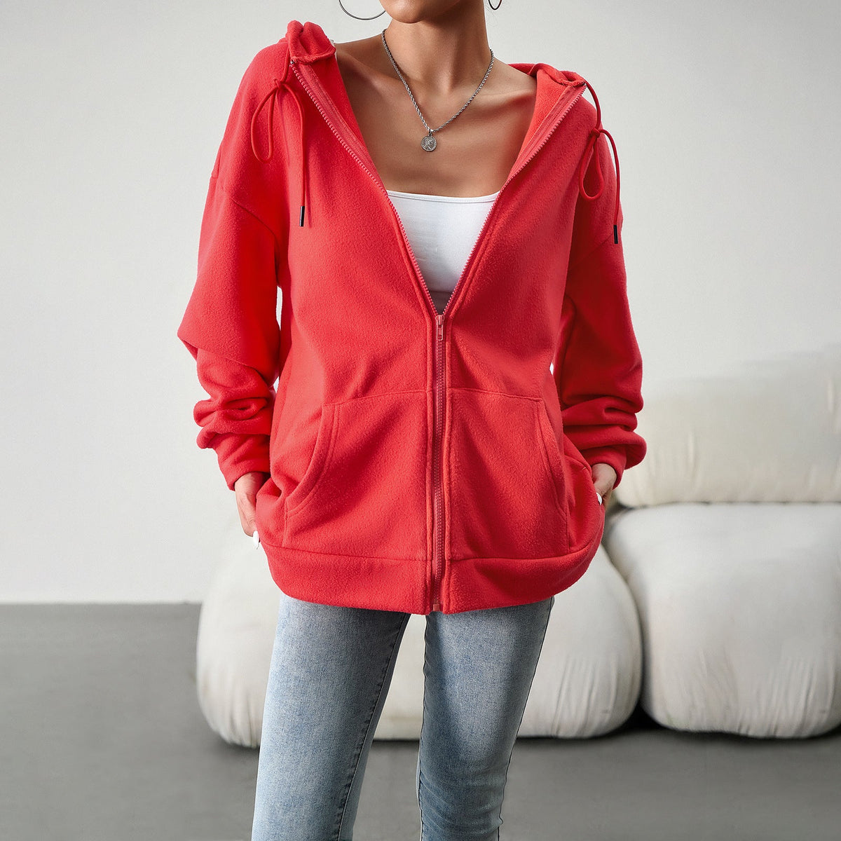 Red hooded zip-front cardigan jacket with drawstring hood and side pockets