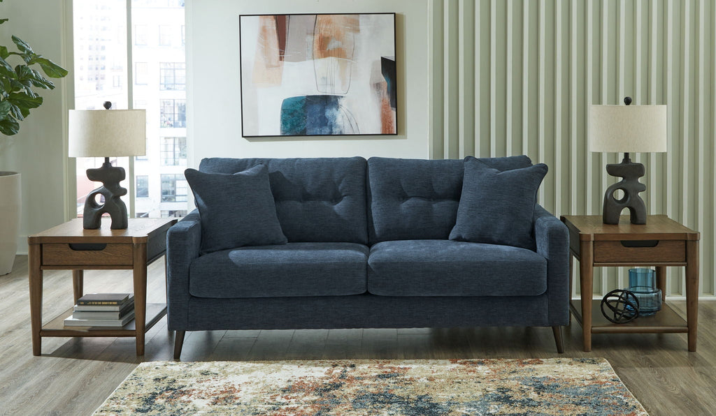 Blue upholstered 2-seat sofa with three back cushions and square arms