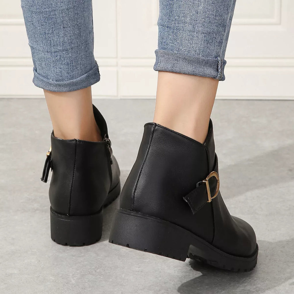 Black ankle boots with buckle accent and back pull tab, side zipper, chunky heel.