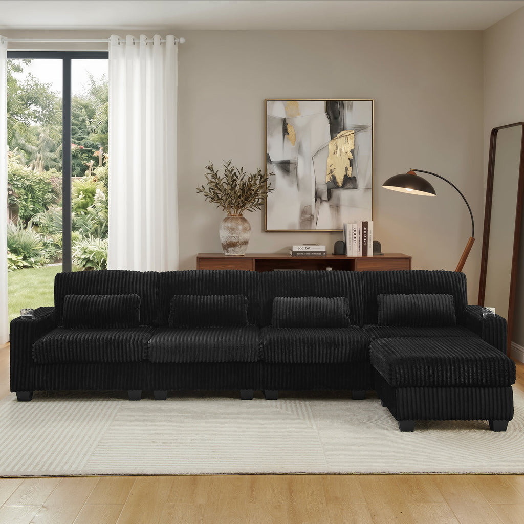 Black corduroy sectional sofa with chaise and wide back cushions, front view