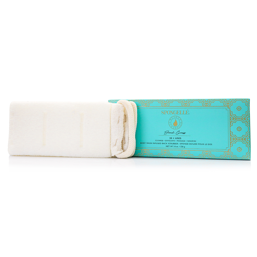 Beach Grass body wash infused back scrubber beside turquoise packaging