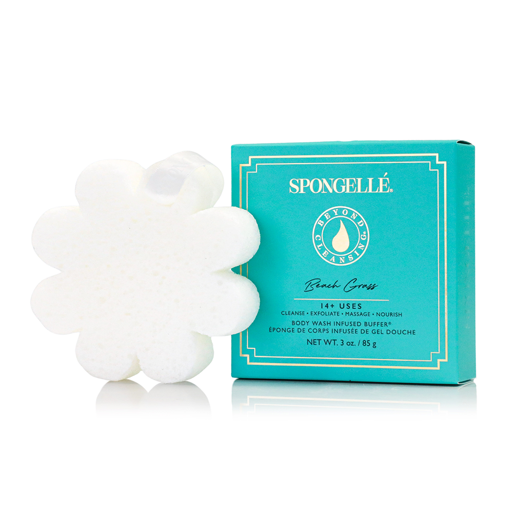 Teal boxed bath gel with white flower-shaped exfoliating soap bar