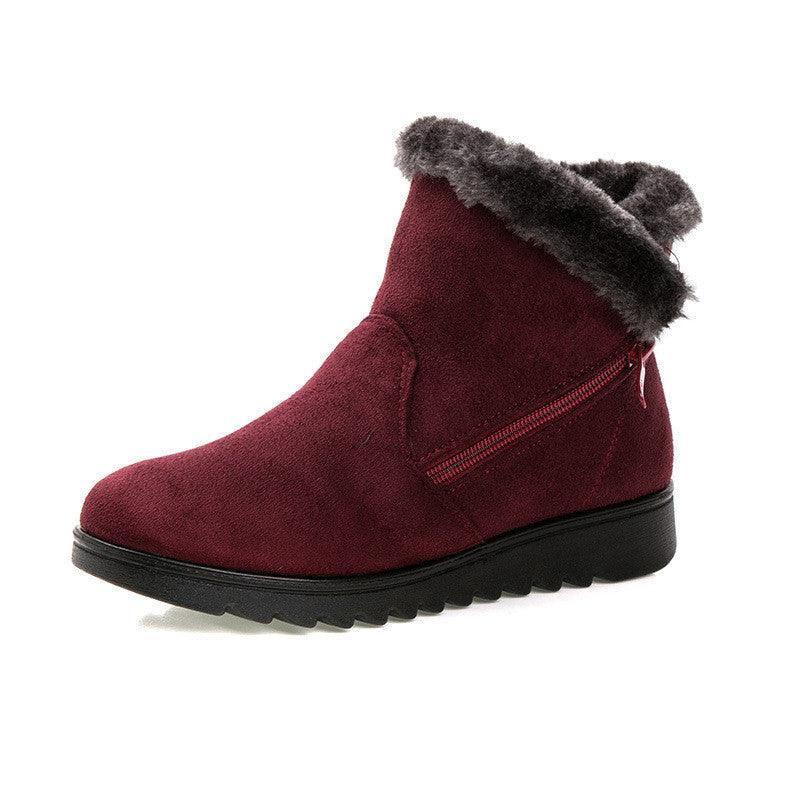 Women’s burgundy winter ankle boots with faux-fur cuff, side zipper, and chunky platform sole.
