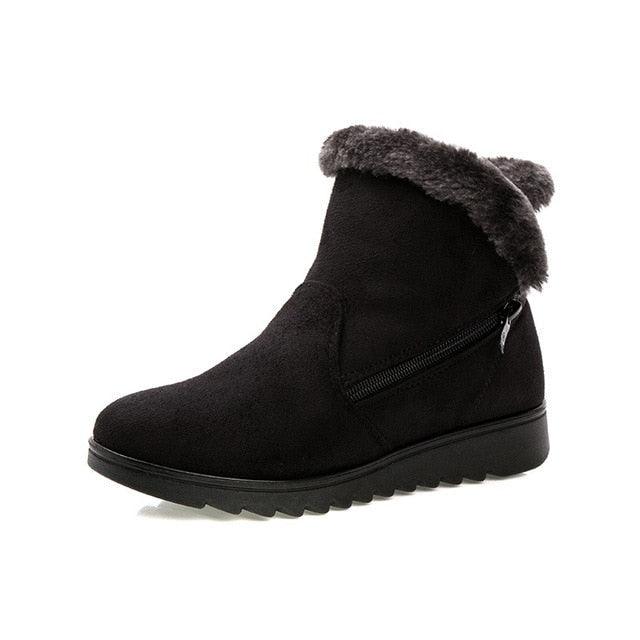 Women’s winter ankle boot in black suede with faux fur cuff and side zipper