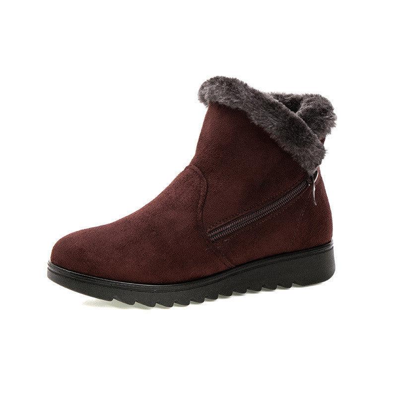 Women’s dark brown winter ankle boots with faux-fur cuff, side zipper, and chunky tread sole.
