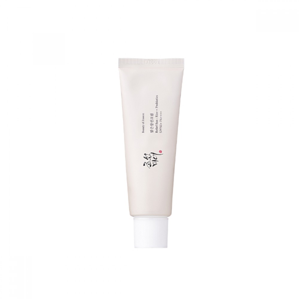 White SPF sunscreen squeeze tube with ridged cap and printed label