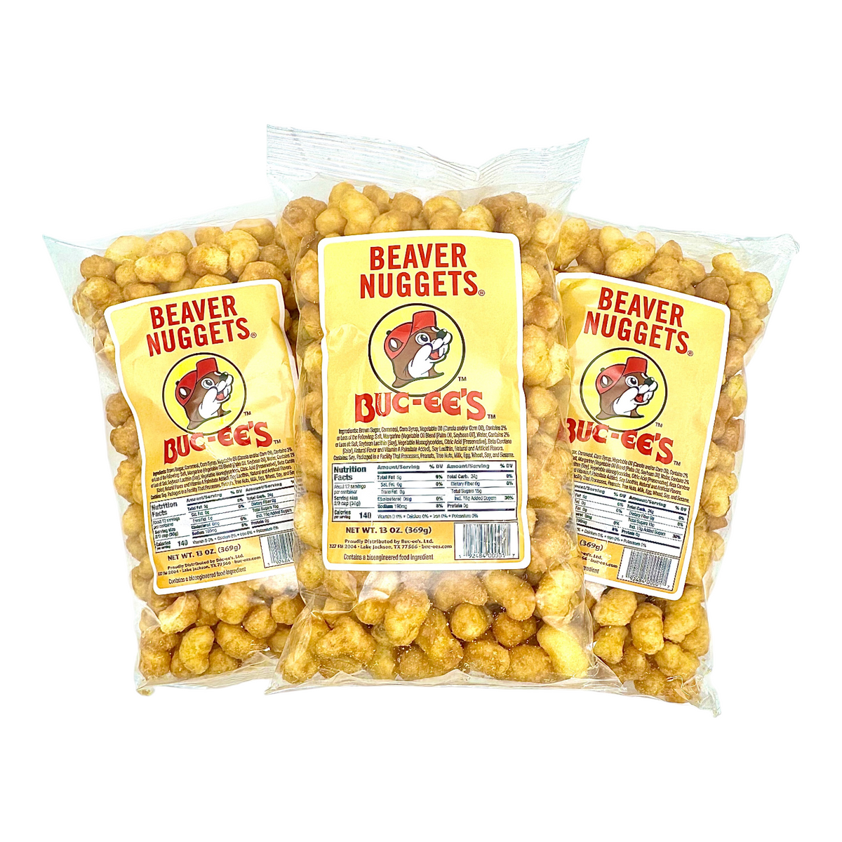 Three Beaver Nuggets snack bags with Buc-ee's labels, filled with golden nugget pieces.