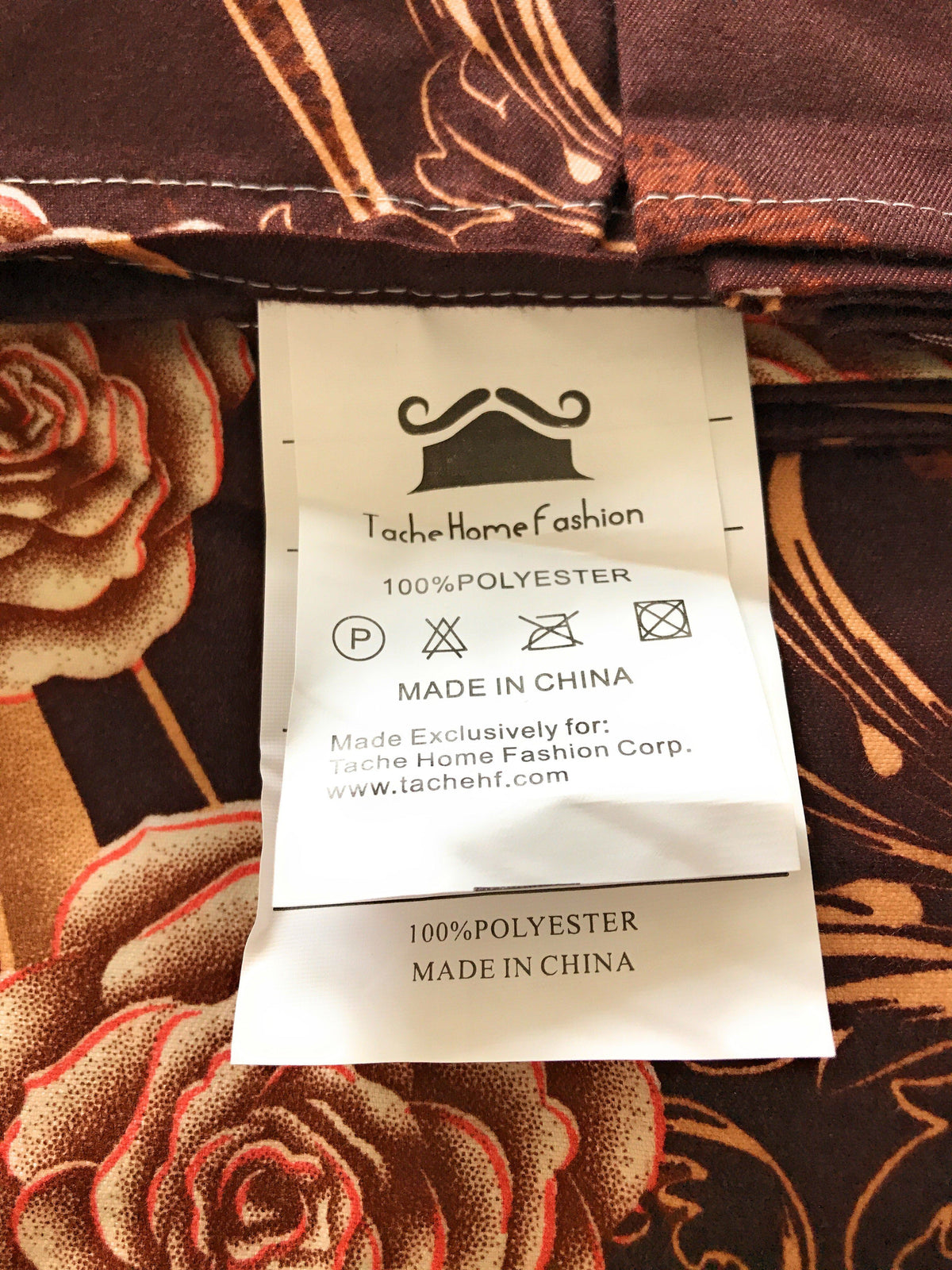 Clothing care tag on brown polyester bed sheet set, made in China