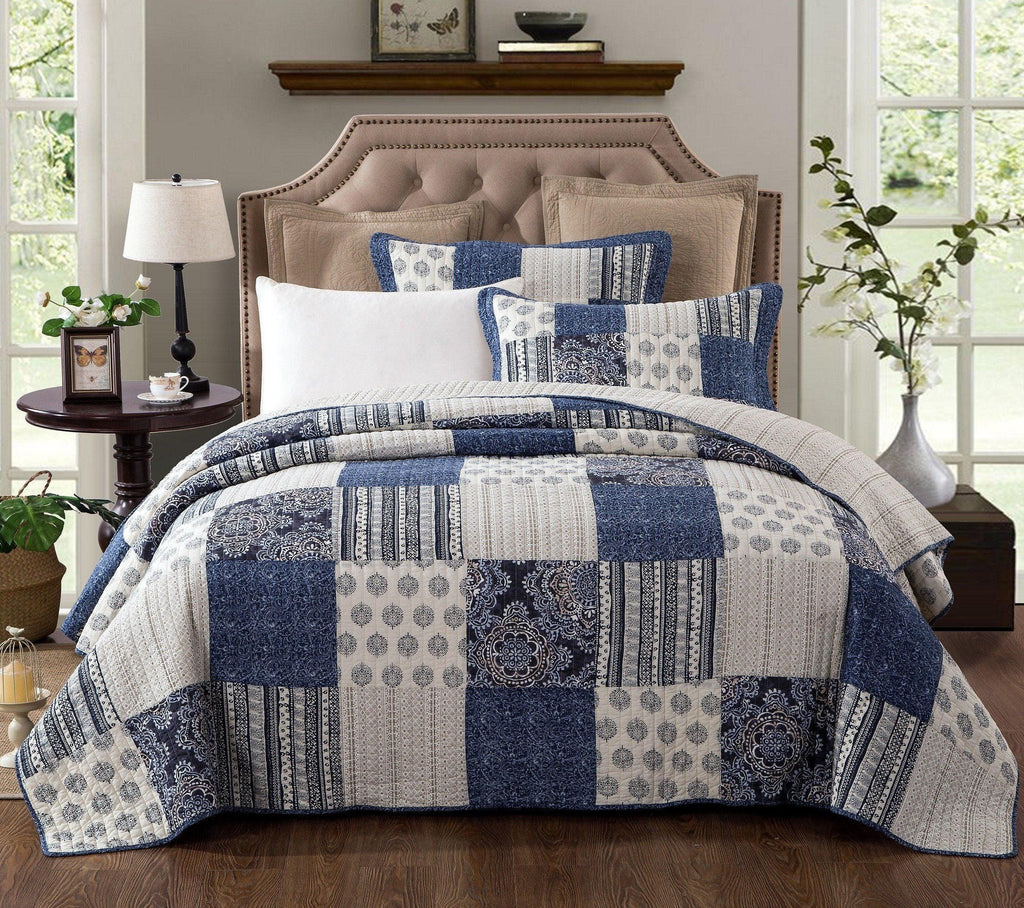 Denim blue patchwork cotton quilt set with geometric patterns and matching shams