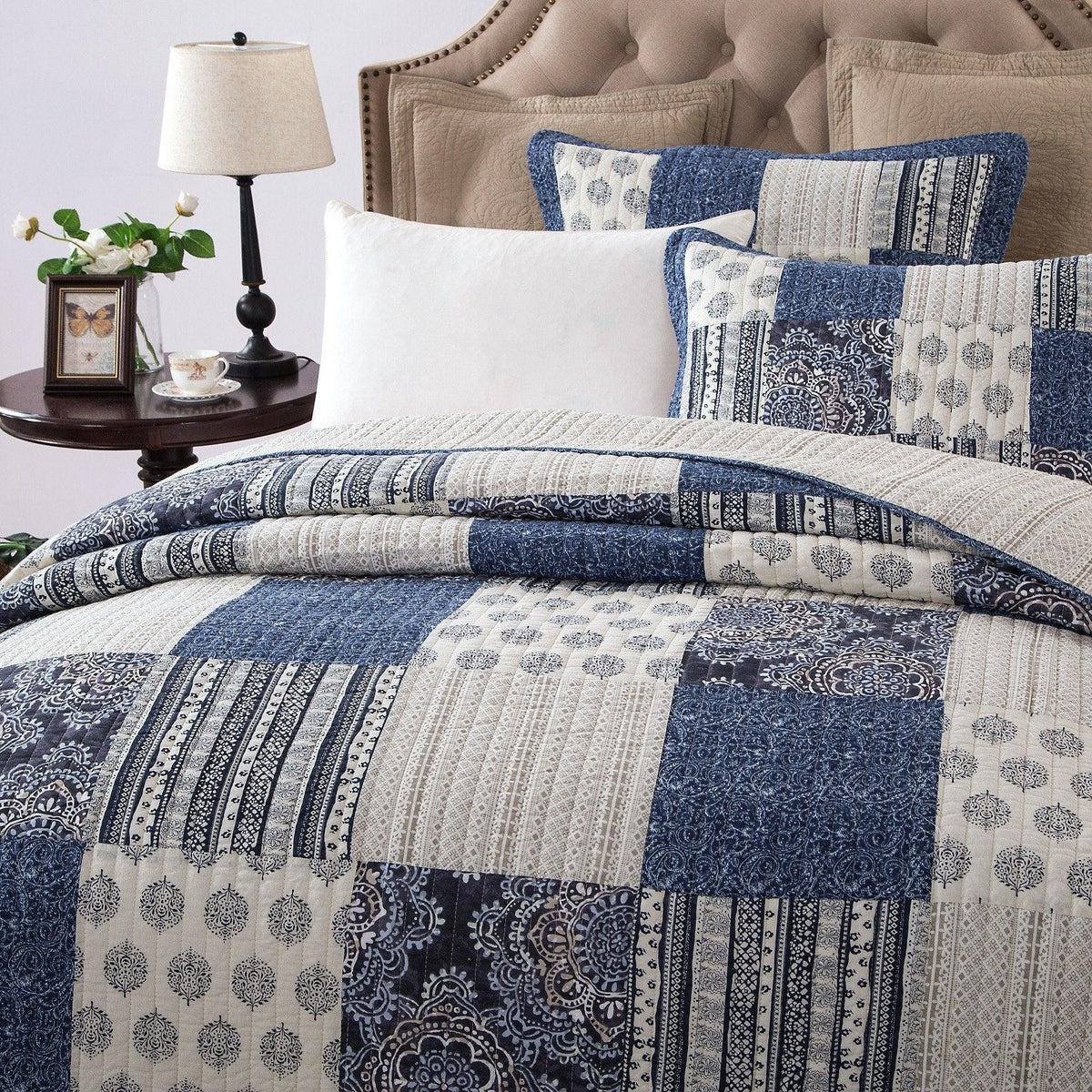 Denim blue patchwork cotton quilt set with patterned quilt and pillow shams