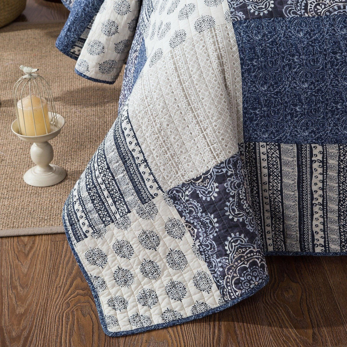 Patchwork cotton quilt in white and denim blue with quilted diamond stitching