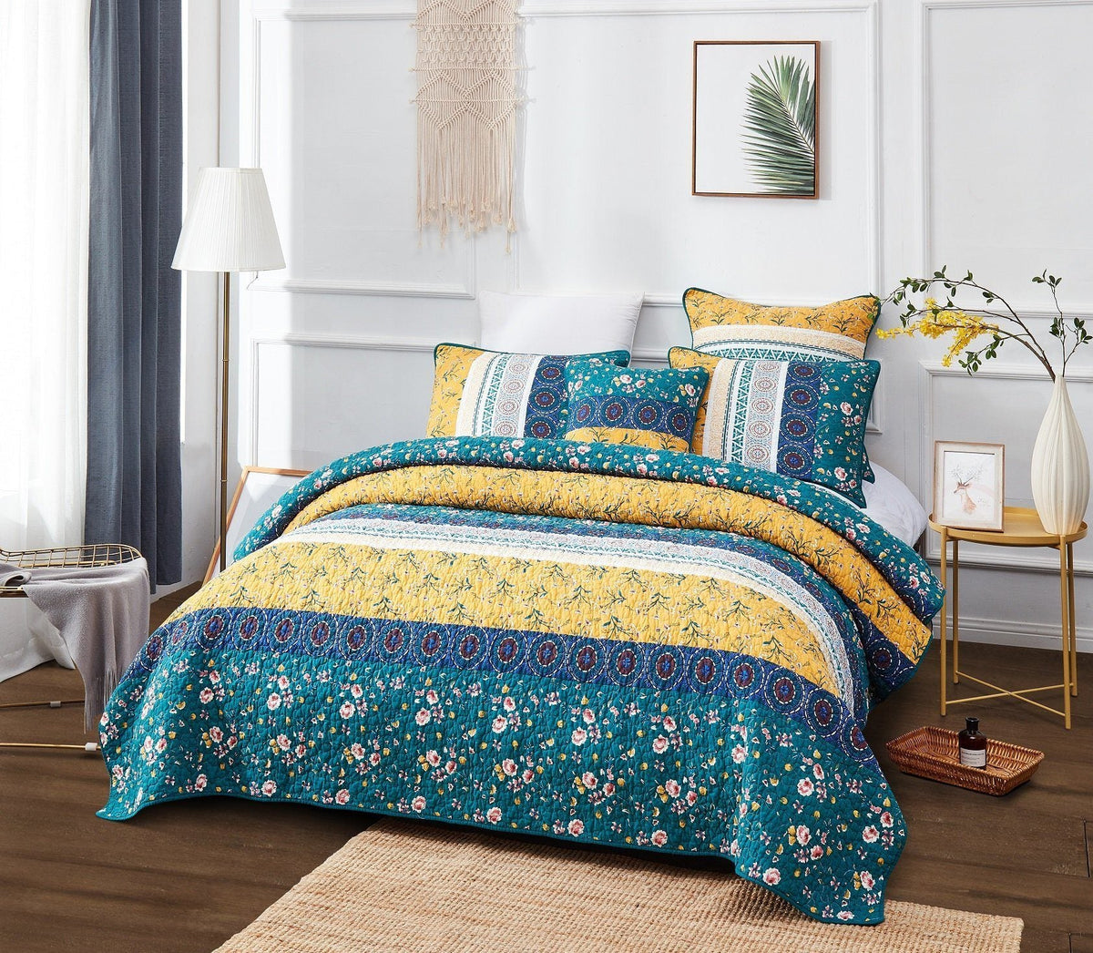 Patchwork quilt set with teal floral bedcover and yellow border, matching pillows