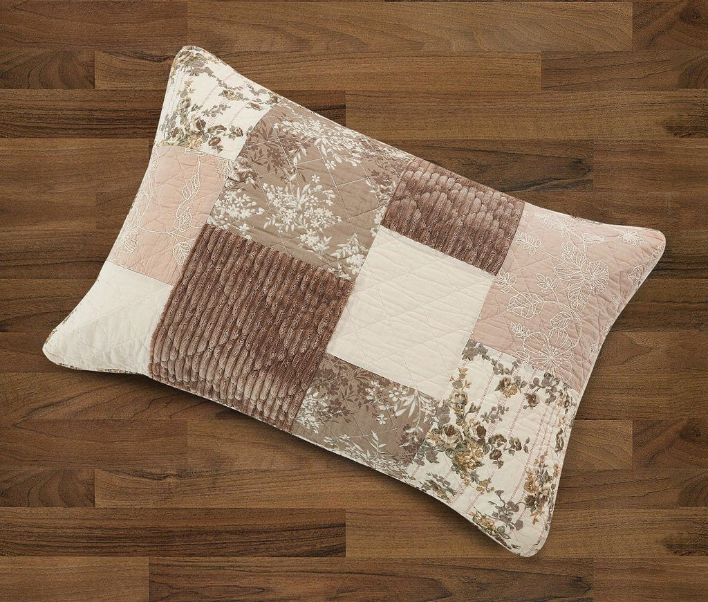Patchwork quilt pillow with floral patches in beige and brown