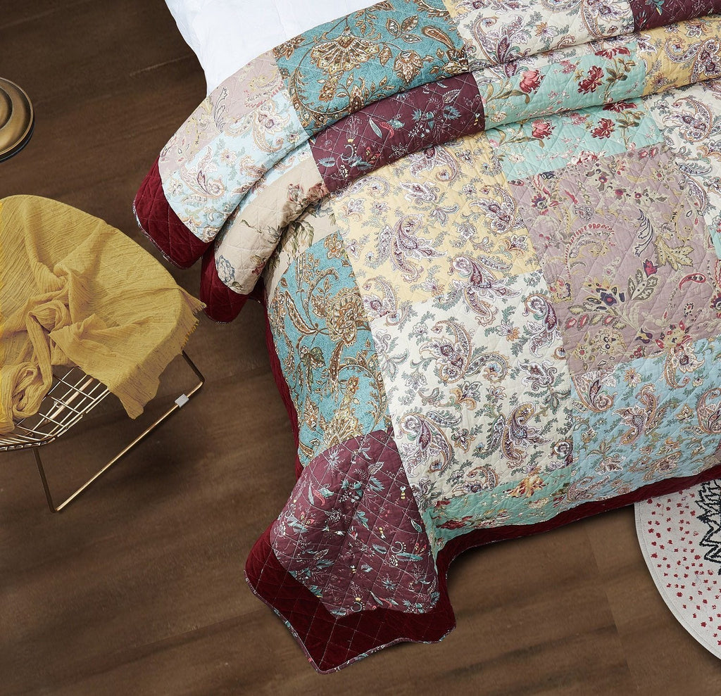 Paisley patchwork quilt and coordinating sham with burgundy corner accents