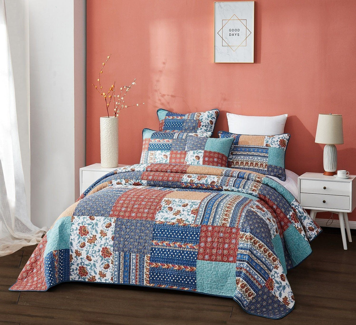 Quilted patchwork bedspread set with blue and red floral strips and cream accents