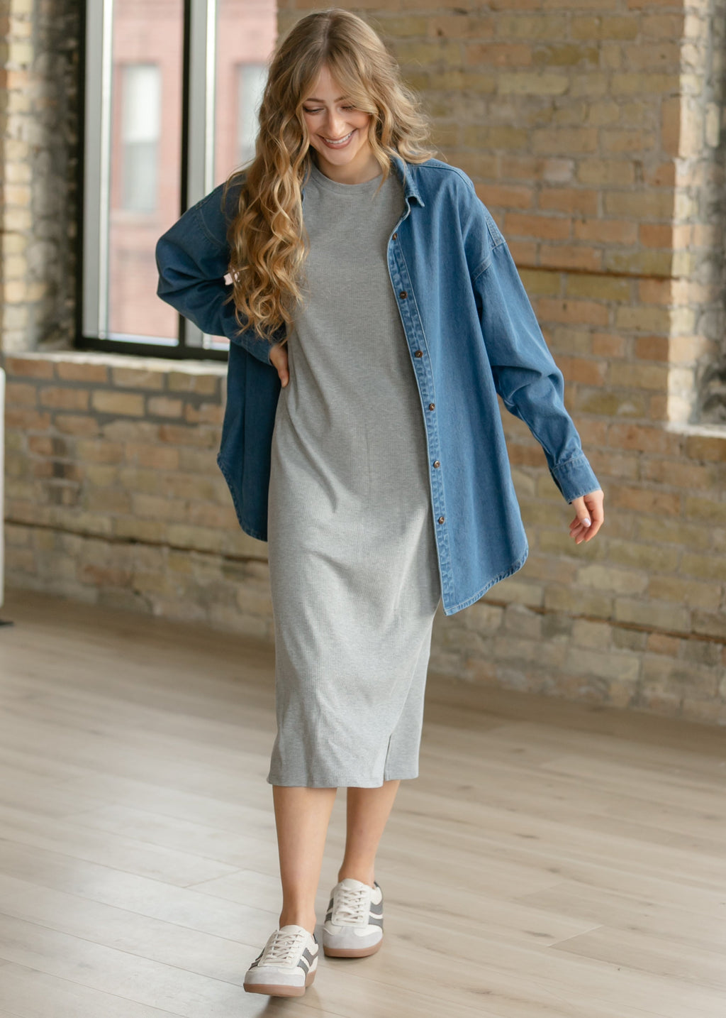 Blue denim button-up top, long sleeves and button front, paired with a gray midi skirt