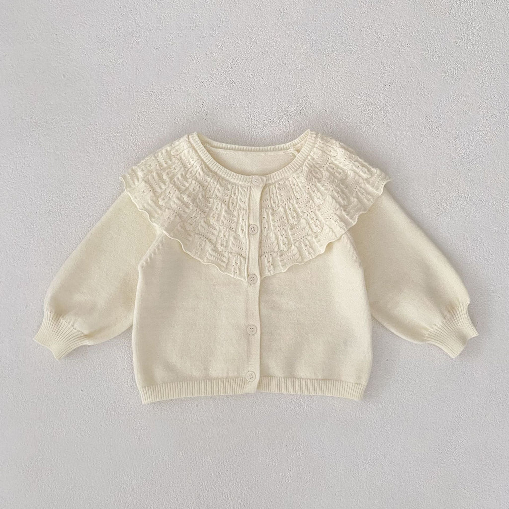 Cream baby knitted coat with textured ruffled lapel and button-front