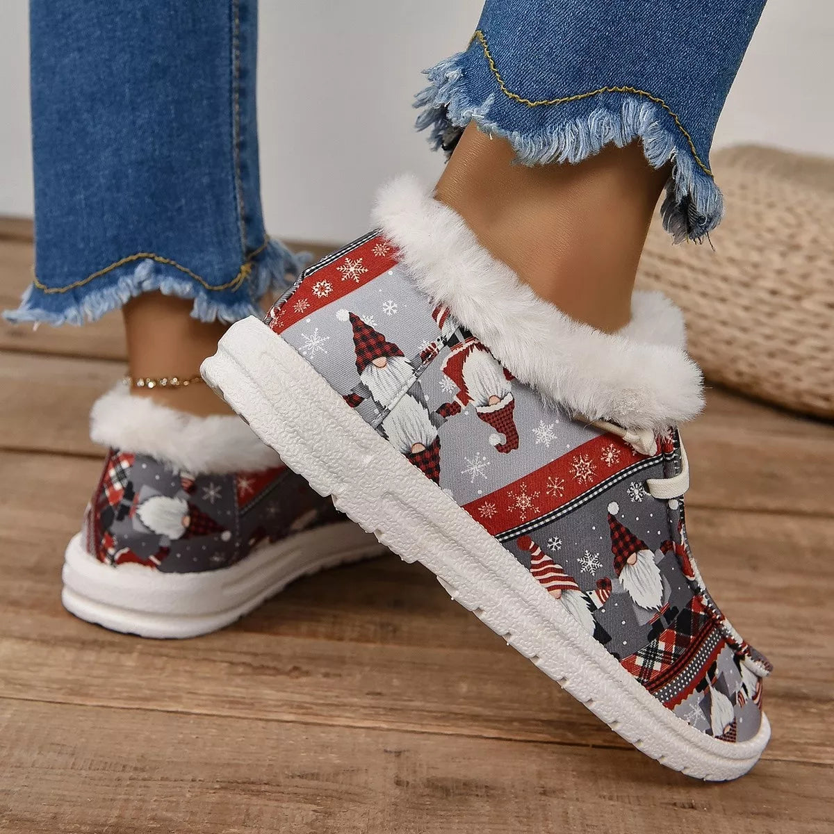 Christmas-themed sneakers in red and gray with faux fur trim and white laces