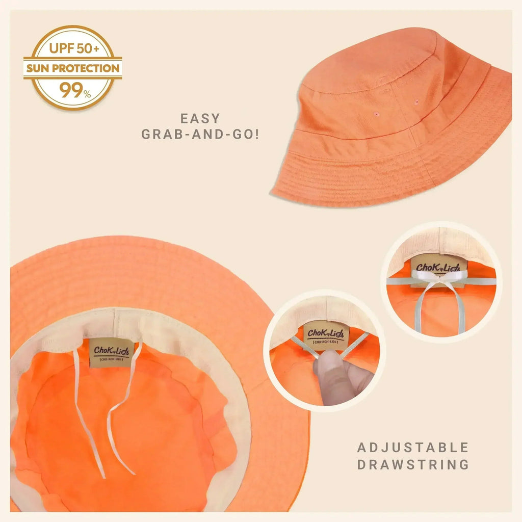 Washed cotton bucket hat in coral orange with adjustable drawstring and wide molded brim.