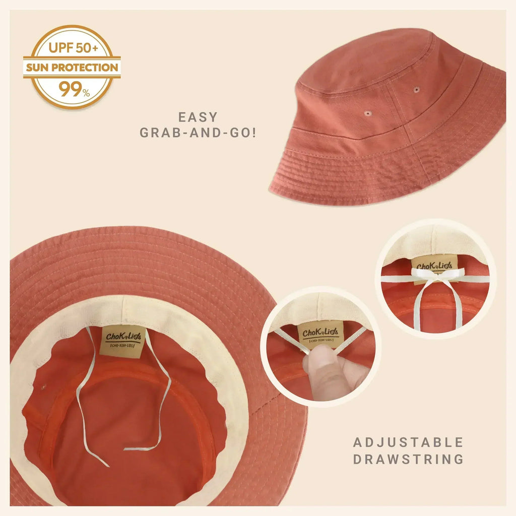 Washed cotton bucket hat in dusty rose pink with adjustable drawstring and molded brim.