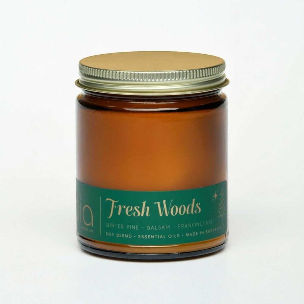 Amber Fresh Woods candle jar with metal lid, unlit