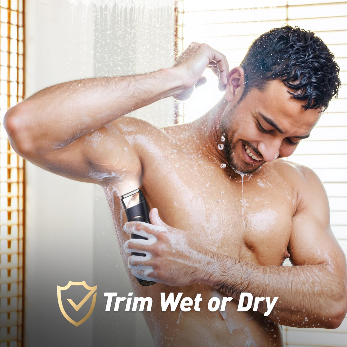 Black electric shaver for wet or dry use, held in shower with water droplets