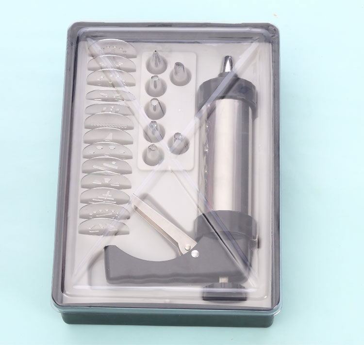 Biscuit press accessory kit in plastic box with discs and nozzles