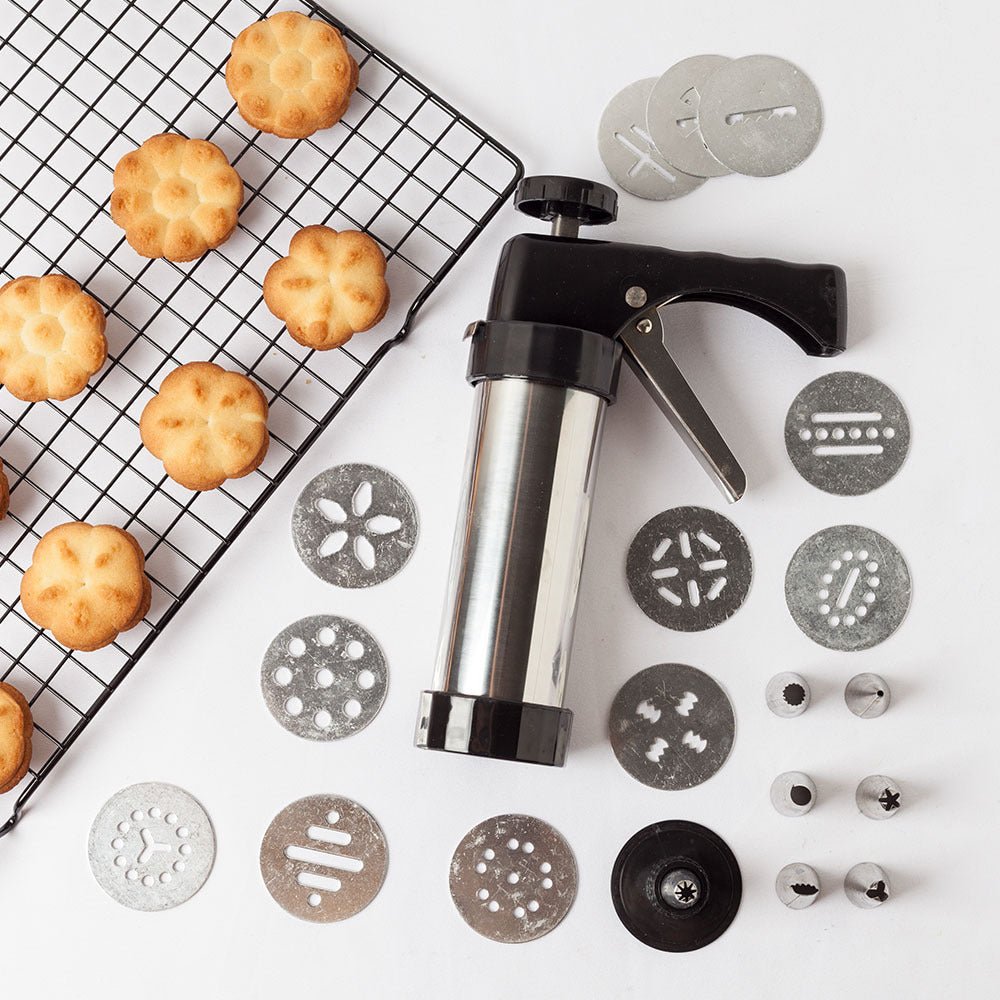Stainless steel biscuit press with cookie discs and filled cookie shapes