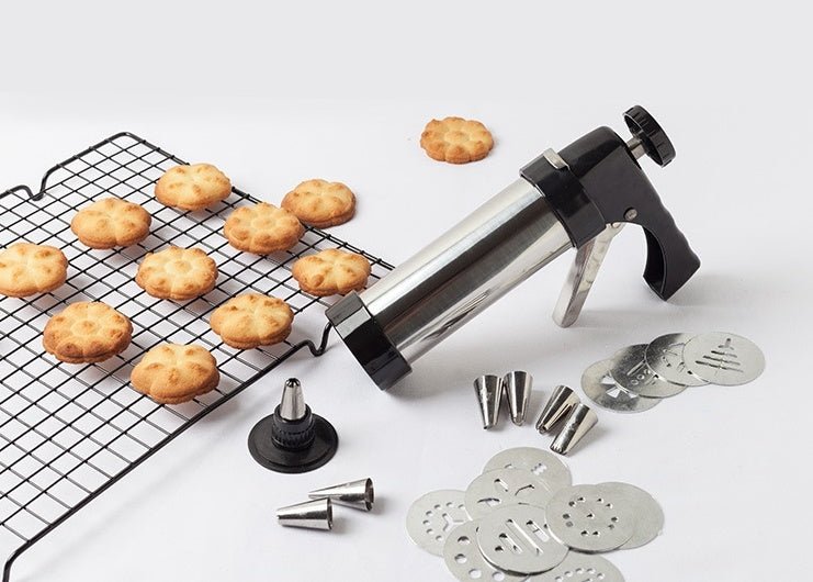 Cookie gun with stainless barrel, multiple metal nozzles, and cookie tray