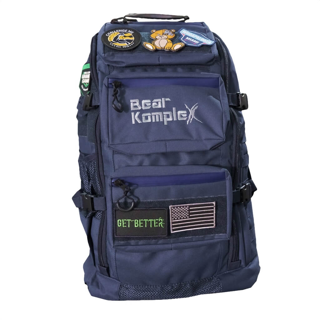 Navy blue military backpack with stacked front pockets and patch accents