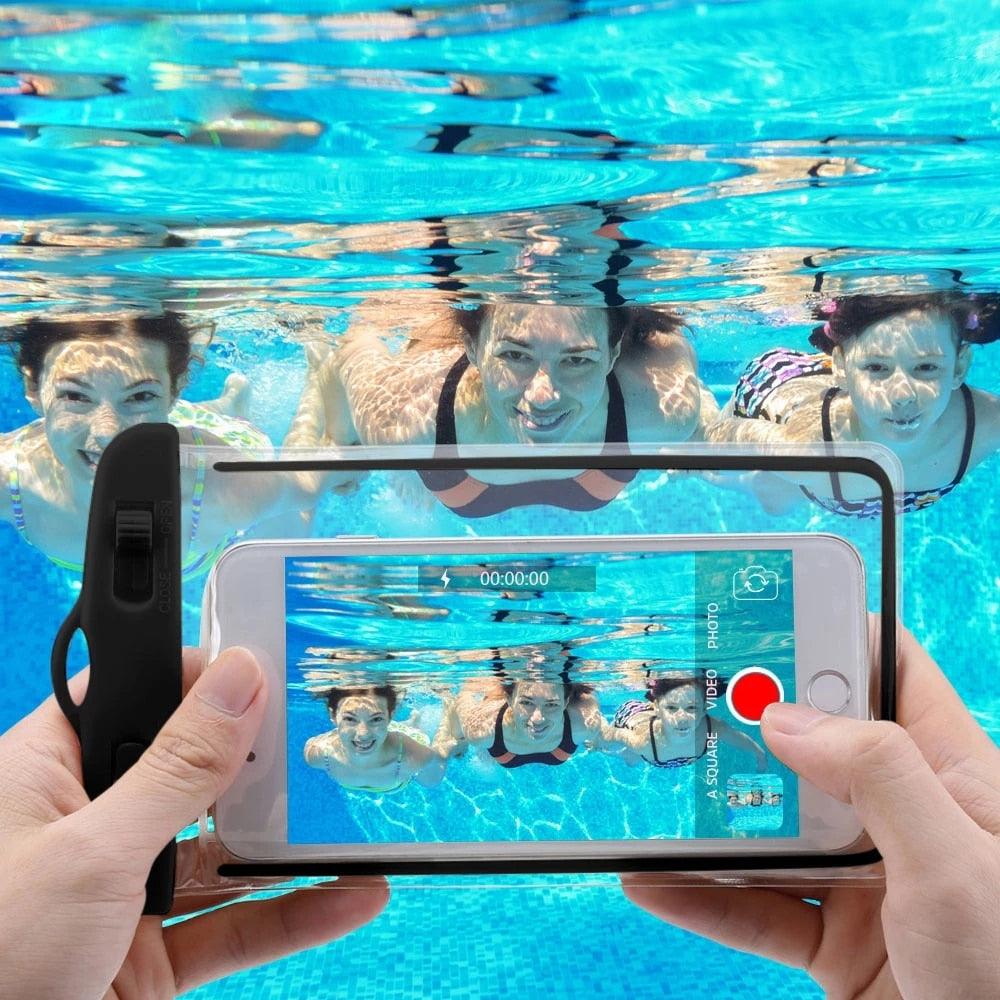 Black waterproof phone pouch with clear window held in hands in pool