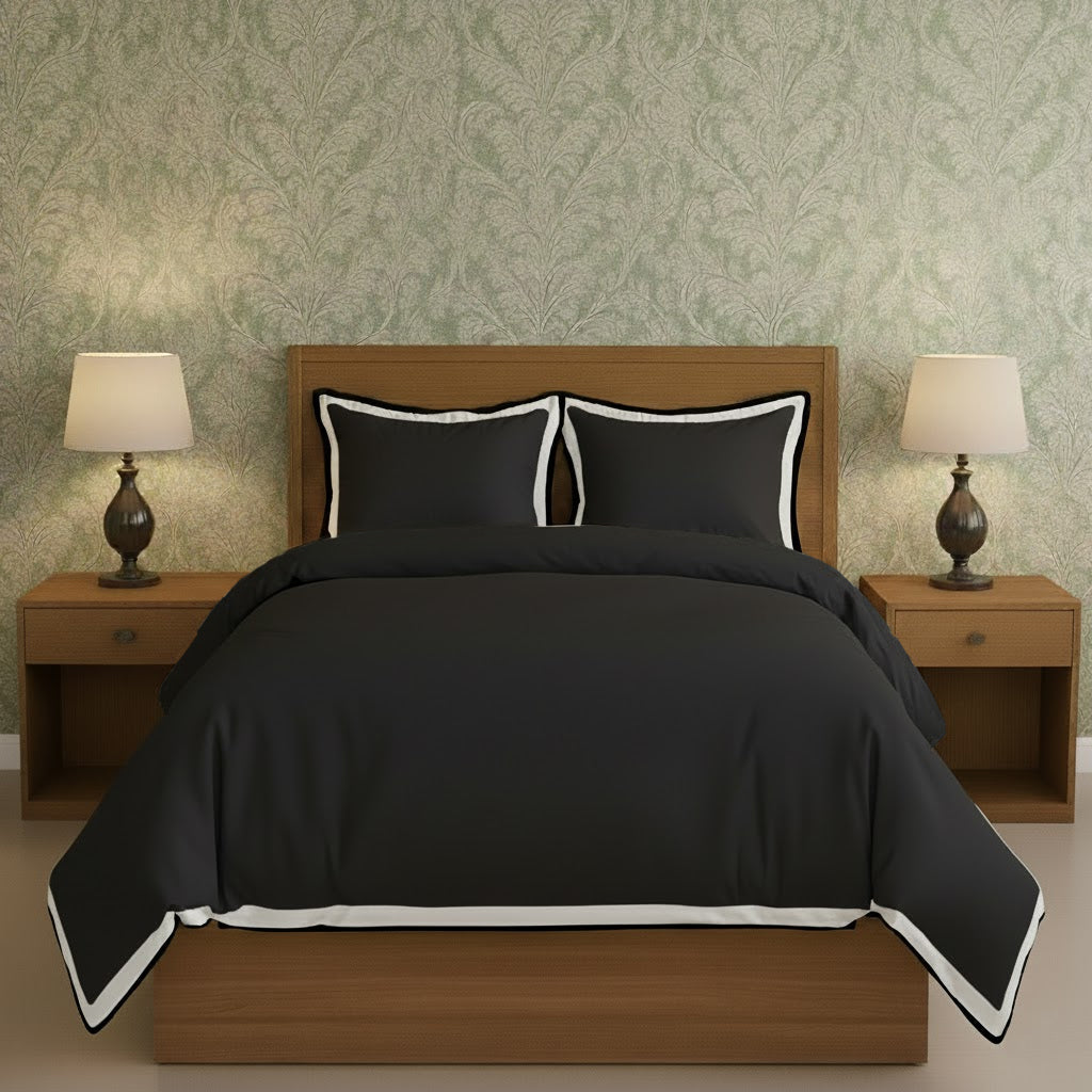 Black duvet cover set with white border frame and matching pillow shams