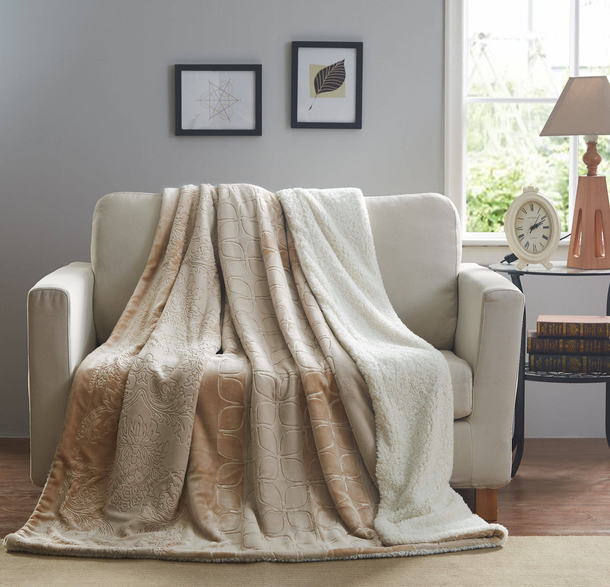 Beige embossed sherpa throw blanket draped over armchair with plush edge