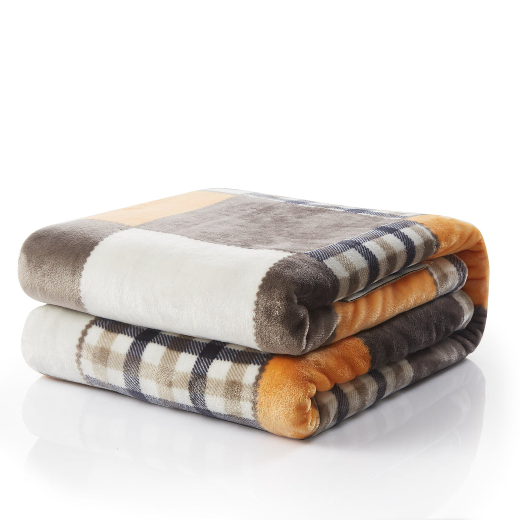 Folded plush plaid throw blanket with orange stripe accents and gray-brown patches