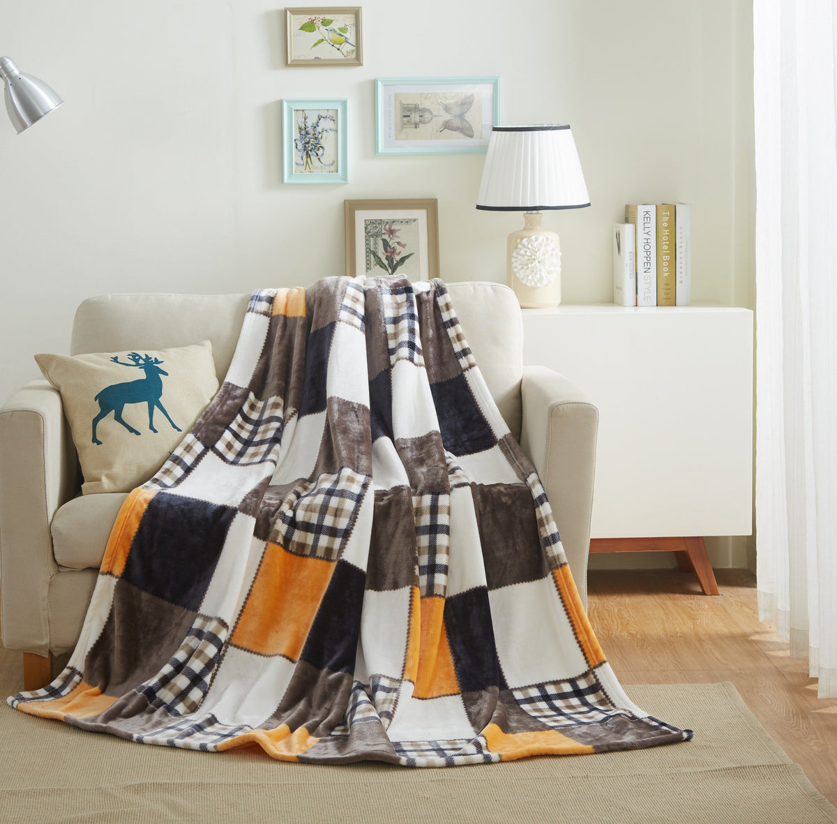Plaid fleece bed throw blanket in orange, brown, and white patchwork pattern
