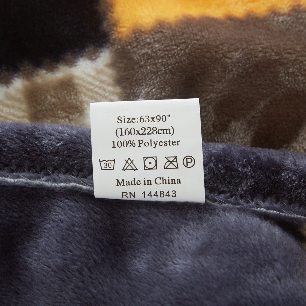 Plush plaid blanket fabric with size and care label
