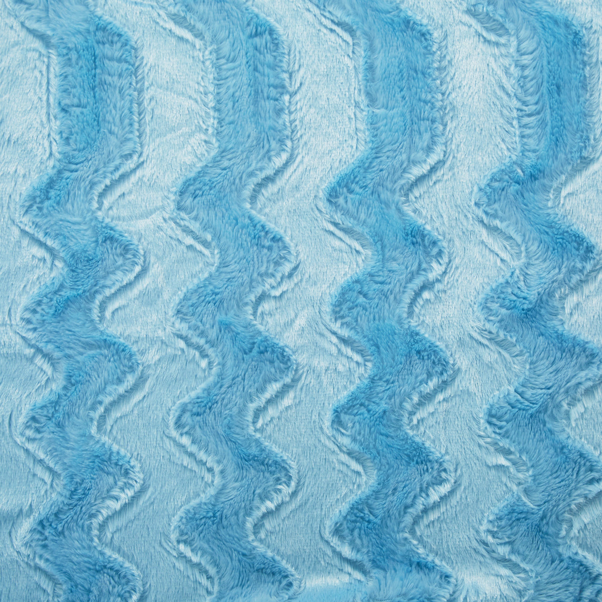 Blue faux fur throw blanket close-up showing wavy textured pattern