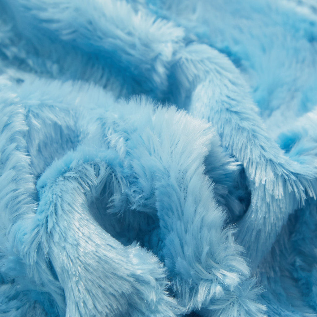 Blue faux fur throw blanket close-up of dense, shaggy pile