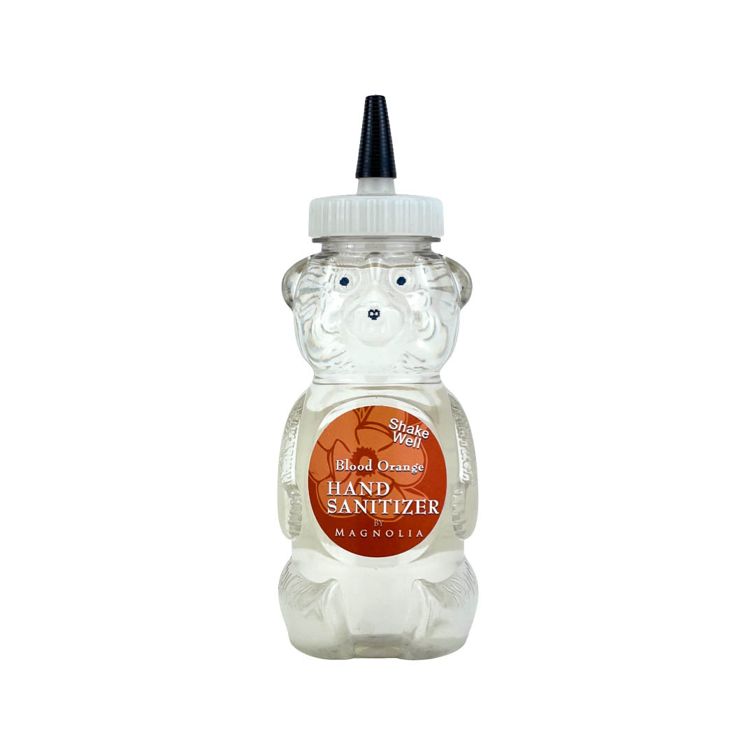 Bear-shaped hand sanitizer bottle, clear plastic with Blood Orange label