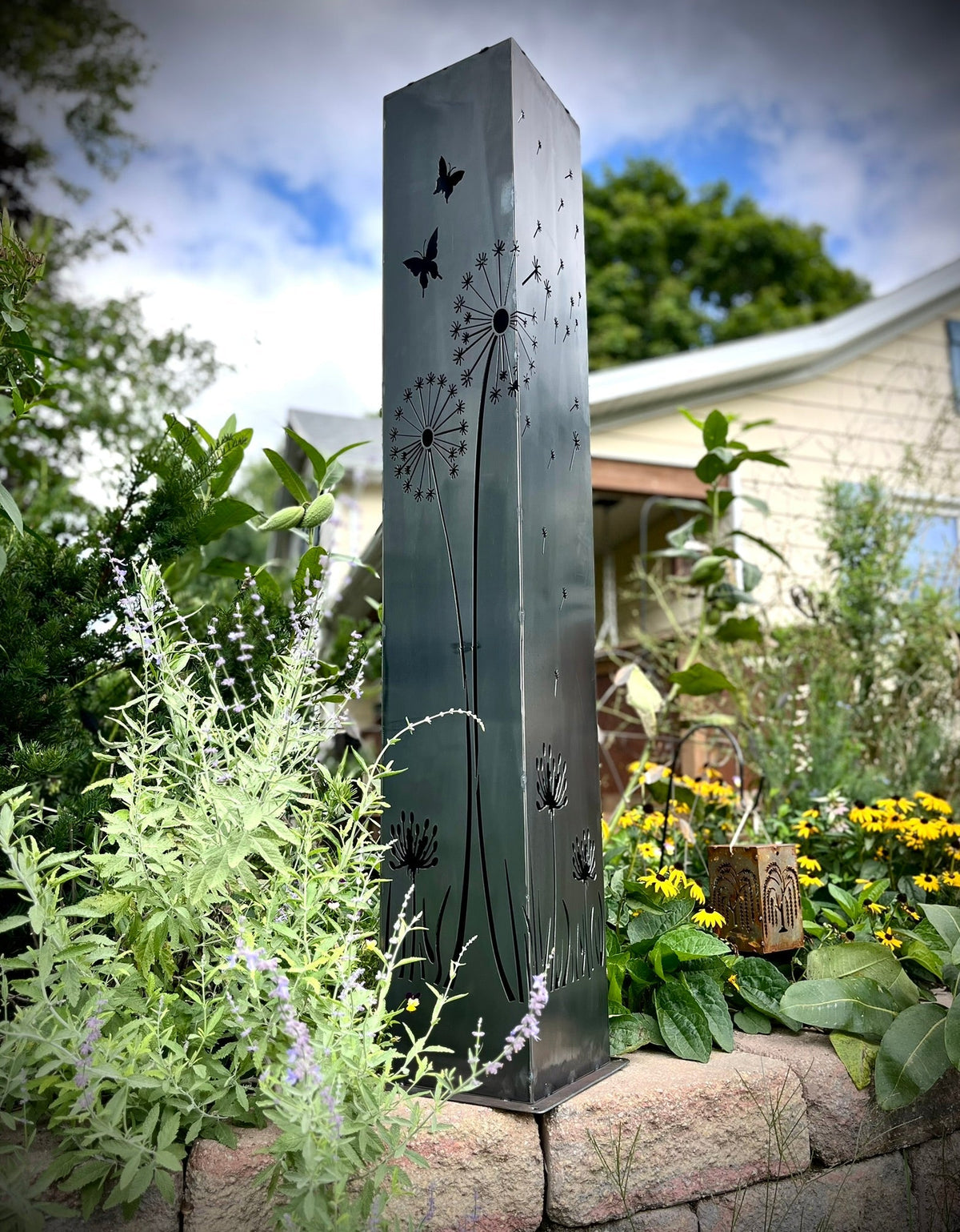 Solar steel luminary pillar light in light blue-grey with dandelion and butterfly silhouettes