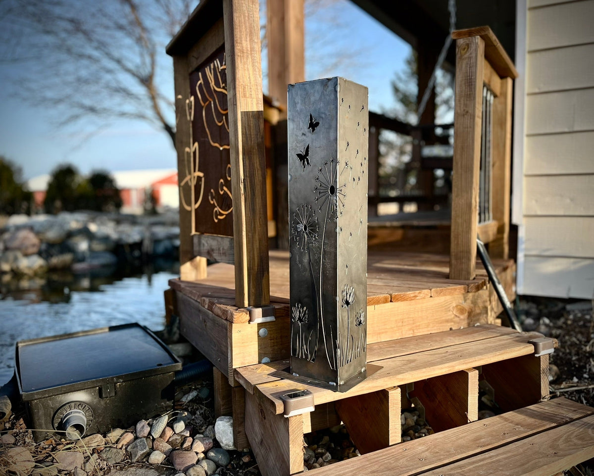 Solar steel luminary pillar light with black butterfly and dandelion metal cutouts