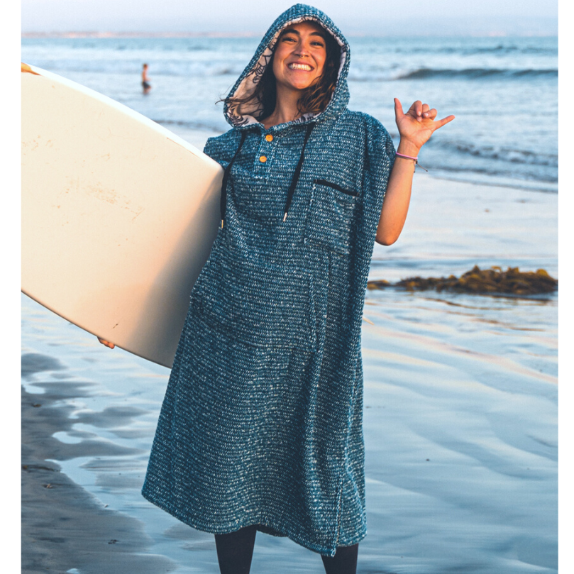 Blue hooded blanket robe with button placket and short sleeves, worn outdoors