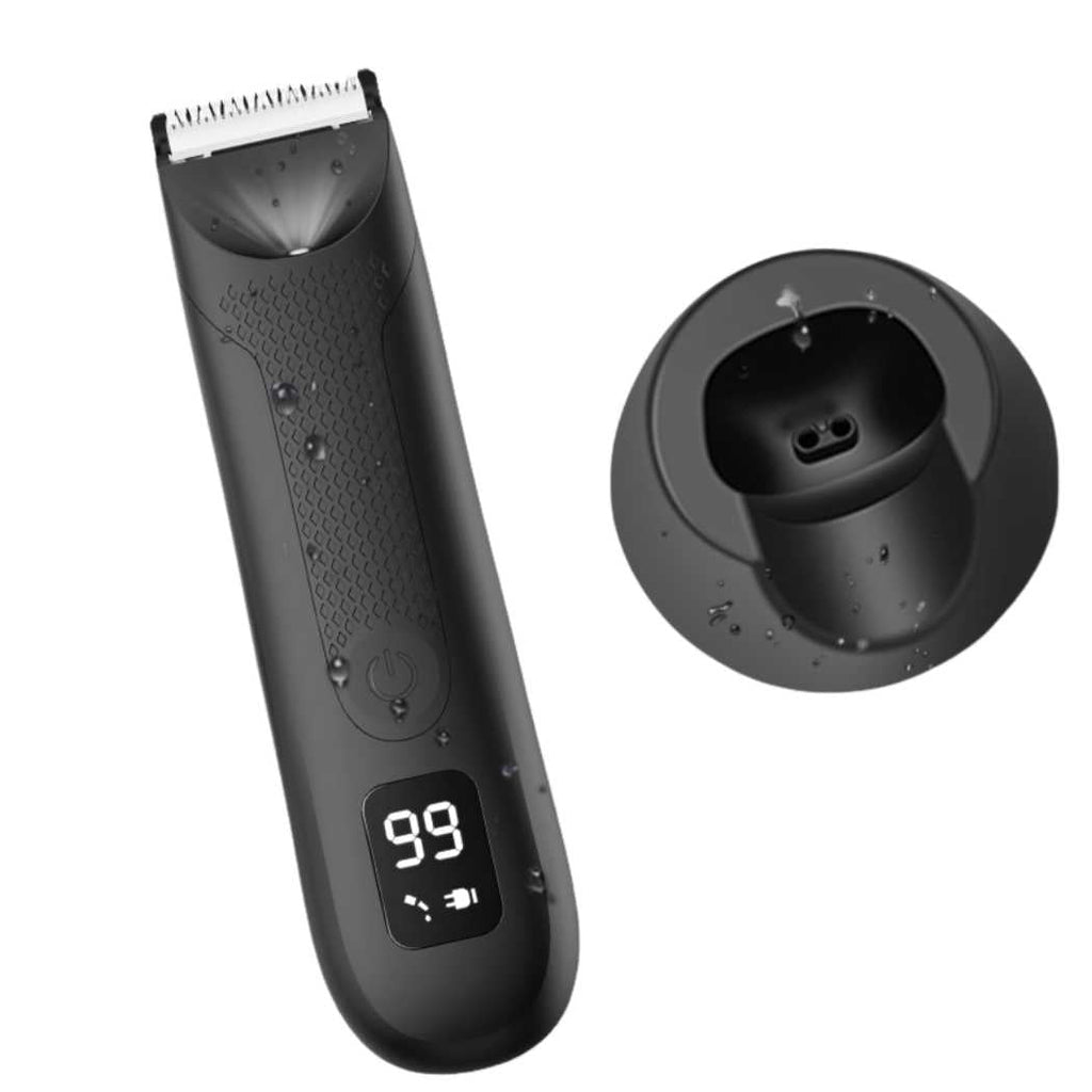 Black electric grooming shaver with charging base dock and visible blade head