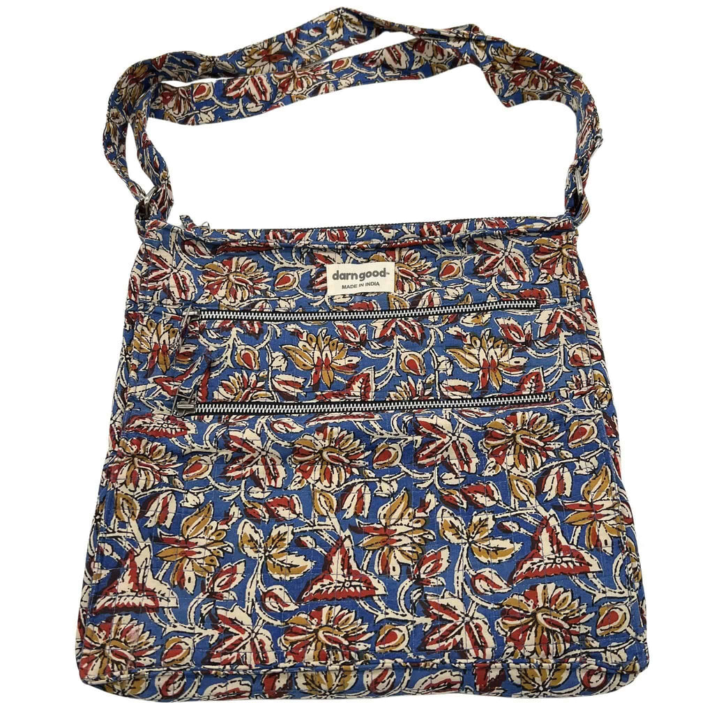 Floral patterned crossbody bag in blue with brown and tan accents, top zip closure