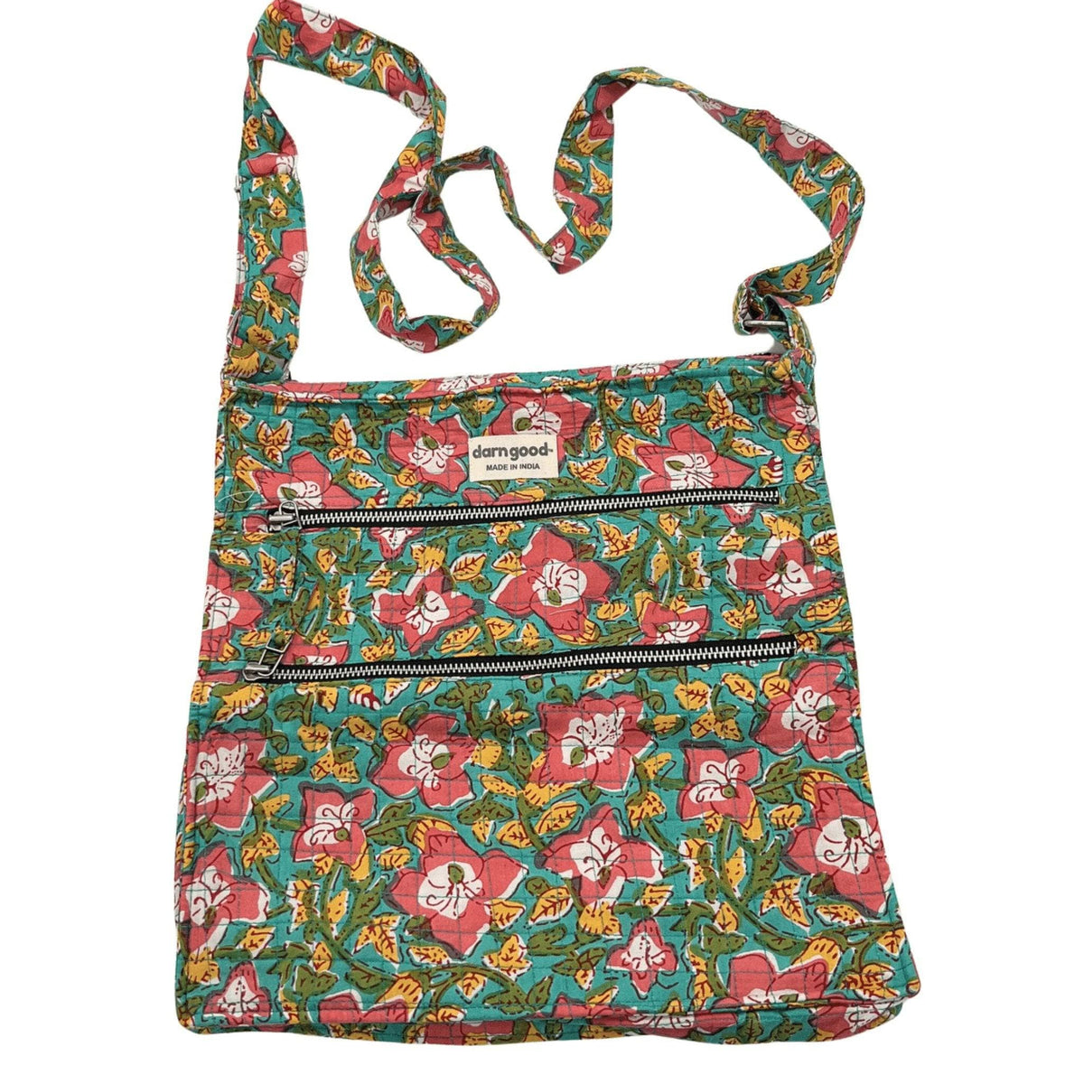 Animal print crossbody bag in teal and green with pink accents, top zip closure