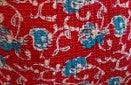 Multicolor patchwork fabric panel with stitched pattern and small motif details