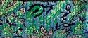 Green and teal patterned patchwork fabric with stitched outlines and decorative motifs